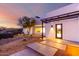 Modern home exterior with desert landscaping at dusk at 13924 E Windstone Trl, Scottsdale, AZ 85262