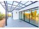Modern home exterior with glass doors and pergola at 13924 E Windstone Trl, Scottsdale, AZ 85262