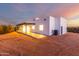 View of the back of a modern home at dusk at 13924 E Windstone Trl, Scottsdale, AZ 85262