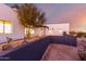 Desert landscape featuring a modern home with clean lines and a neutral color palette at 13924 E Windstone Trl, Scottsdale, AZ 85262