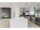 Modern kitchen featuring a large island, stainless steel appliances, and custom cabinetry at 13924 E Windstone Trl, Scottsdale, AZ 85262