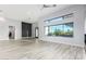 Spacious living room with hardwood floors and a view to the backyard at 13924 E Windstone Trl, Scottsdale, AZ 85262