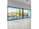Sliding glass doors in living room open to a patio with desert views at 13924 E Windstone Trl, Scottsdale, AZ 85262