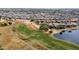 Community overview with golf course and lake at 1950 N 142Nd Ave, Goodyear, AZ 85395