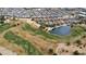 Community overview with golf course and lake at 1950 N 142Nd Ave, Goodyear, AZ 85395
