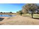 Landscaped backyard with pond and golf course view at 1950 N 142Nd Ave, Goodyear, AZ 85395