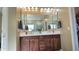 Double vanity bathroom with mirrored cabinets at 1950 N 142Nd Ave, Goodyear, AZ 85395