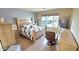 Spacious bedroom with large bed, dresser, and seating at 1950 N 142Nd Ave, Goodyear, AZ 85395