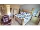 Main bedroom with a king-size bed and light wood furniture at 1950 N 142Nd Ave, Goodyear, AZ 85395