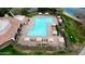 Inviting community pool with lounge chairs and umbrellas at 1950 N 142Nd Ave, Goodyear, AZ 85395