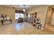 Bright dining room with tile floor and decorative furniture at 1950 N 142Nd Ave, Goodyear, AZ 85395