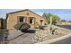 Landscaped yard with a two-car garage at 1950 N 142Nd Ave, Goodyear, AZ 85395