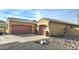 Two-car garage and desert landscaping at 1950 N 142Nd Ave, Goodyear, AZ 85395