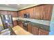 Kitchen features granite countertops and stainless steel appliances at 1950 N 142Nd Ave, Goodyear, AZ 85395