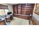 Home office with built-in wooden shelves and desk at 1950 N 142Nd Ave, Goodyear, AZ 85395