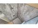 Modern shower with gray wall panels and grab bar at 1950 N 142Nd Ave, Goodyear, AZ 85395