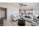 Comfortable living room showcasing tile floors and an open floor plan to the kitchen at 28205 N 213Th Dr, Wittmann, AZ 85361