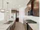 Modern kitchen with stainless appliances, granite counters, and island sink at 3339 E Audrey Dr, San Tan Valley, AZ 85143