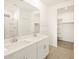 Bathroom with double sinks, large mirrors, and access to the walk-in closet and shower at 3390 E Audrey Dr, San Tan Valley, AZ 85143