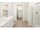 Modern bathroom features double sinks, tile flooring, and a glass-enclosed shower at 3390 E Audrey Dr, San Tan Valley, AZ 85143