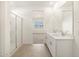 Modern bathroom with double sinks, glass-enclosed shower, and neutral tones at 3390 E Audrey Dr, San Tan Valley, AZ 85143