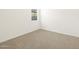 Bright bedroom featuring neutral carpet and a window at 3390 E Audrey Dr, San Tan Valley, AZ 85143