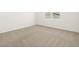 Bright bedroom with neutral carpet and a window providing natural light at 3390 E Audrey Dr, San Tan Valley, AZ 85143