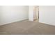 Open bedroom featuring plush carpeting and a view of the ensuite bathroom at 3390 E Audrey Dr, San Tan Valley, AZ 85143