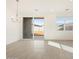 Bright dining room with sliding glass doors and modern chandelier lighting at 3390 E Audrey Dr, San Tan Valley, AZ 85143