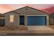 Charming single-story home featuring a blue garage door and desert landscaping at 3390 E Audrey Dr, San Tan Valley, AZ 85143