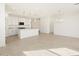 Open-concept kitchen with a kitchen island, recessed lighting, and white cabinetry at 3390 E Audrey Dr, San Tan Valley, AZ 85143