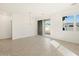 A living area featuring tile flooring, recessed lights, and sliding glass doors at 3390 E Audrey Dr, San Tan Valley, AZ 85143
