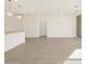 Spacious living area boasts tile floors, recessed lights, and an adjacent kitchen at 3390 E Audrey Dr, San Tan Valley, AZ 85143