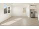 An open concept living space with large windows, tile floors, and recessed lighting at 3390 E Audrey Dr, San Tan Valley, AZ 85143