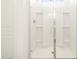 Close-up of the walk-in shower with built-in shelving and glass door at 3390 E Audrey Dr, San Tan Valley, AZ 85143