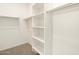 A walk-in closet is equipped with shelving and clothing rods at 3390 E Audrey Dr, San Tan Valley, AZ 85143