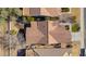 Top-down view of a single-story house with a tile roof and surrounding homes at 36224 W Picasso St, Maricopa, AZ 85138