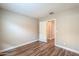 Bedroom with wood flooring and access to bathroom at 36224 W Picasso St, Maricopa, AZ 85138