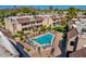 Community pool view with ample seating, palm trees, and inviting blue water at 5995 N 78Th St # 2050, Scottsdale, AZ 85250
