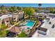 Resort-style pool area with lounge chairs, manicured landscaping, and a covered picnic area at 5995 N 78Th St # 2050, Scottsdale, AZ 85250