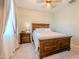 Charming bedroom with wood bed frame and nightstand at 8300 N 186Th Ln, Waddell, AZ 85355