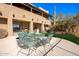 Backyard patio area with dining table set, with a grill and outdoor seating at 15155 E Westridge Dr, Fountain Hills, AZ 85268