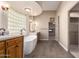 Stunning bathroom with freestanding tub, wood cabinetry, and a large window at 15155 E Westridge Dr, Fountain Hills, AZ 85268