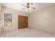 This bedroom has a large closet with wood doors and a bright window at 15155 E Westridge Dr, Fountain Hills, AZ 85268