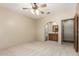 Large bedroom with arched access to the attached bathroom at 15155 E Westridge Dr, Fountain Hills, AZ 85268