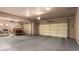 Spacious garage with two doors, neutral paint, concrete floor, and storage at 15155 E Westridge Dr, Fountain Hills, AZ 85268