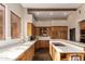 A kitchen with a large island, light countertops, wooden cabinets, and stainless steel appliances at 15155 E Westridge Dr, Fountain Hills, AZ 85268
