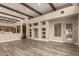 Open living space with wood flooring, built-in shelving, and a large window for natural light at 15155 E Westridge Dr, Fountain Hills, AZ 85268