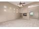 Spacious living room features a fireplace, built-in shelves, neutral tones, and ample natural light at 15155 E Westridge Dr, Fountain Hills, AZ 85268