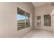 Indoor room with light colored walls, a view to the outdoors and a door at 15155 E Westridge Dr, Fountain Hills, AZ 85268